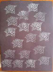 rose stamp print white acrylic on black paper