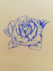 rose stamp print blue acrylic on yellow paper