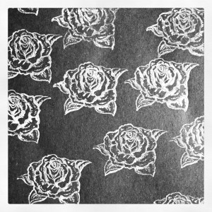 rose stamp print white acrylic on black paper