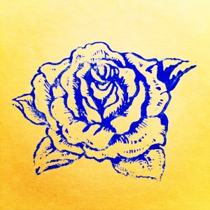 rose stamp print blue acrylic on yellow paper